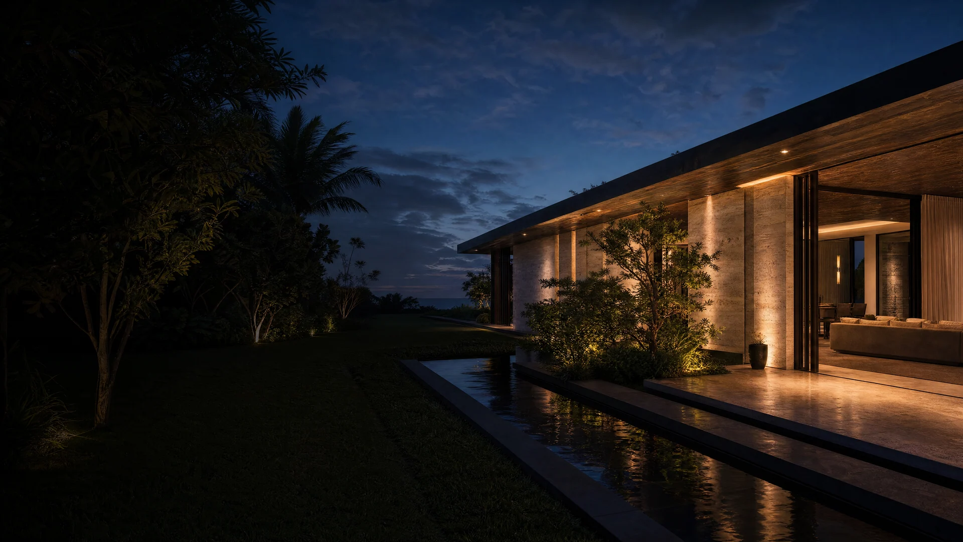 Contemporary tropical residence with warm interiors, reflecting water, and landscaped palms at blue hour.